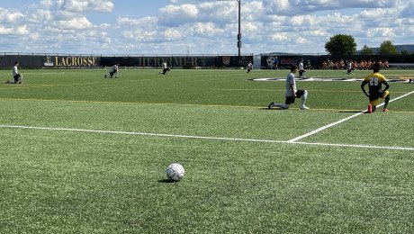 Mens Soccer kneeling 1